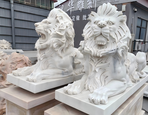 Pair Sunglow Laying Lions on Base 47 Inches High